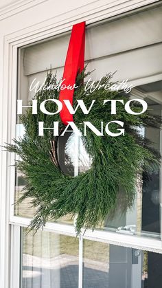 a green wreath with red ribbon hanging on a window sill that says, you can't have how to hang