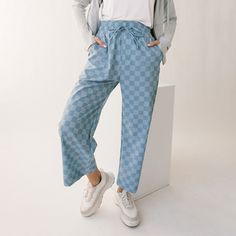 Keep it cool in our Blue Checker Audreys! Featuring a high-waisted 3 inch waistband and a cropped leg for ultimate comfort and confidence. Our Audrey Pants have never looked, or felt, so good! Wide-legged Slightly cropped length 3" Waistband with adjustable drawstring Front & back pockets Available in tall and petite sizes INSEAMS: Petite is 2" shorter and tall is 2" longer than regular inseams. XXS - 23.5" XS - 24" S - 24" M - 24" L - 24.5" XL - 24.5" XXL - 24.5" Cute Checkered Jeans, Albion Fit Swim, Albion Fit Swimsuit, Checker Pants, Albion Fit, Keep It Cool, Maternity Swimsuit, Travel Pants, Pants Blue