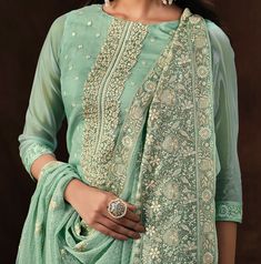 COLOR : Mint Green FABRIC : Top - Soft Organza, Bottom - Dull Santoon, Dupatta - Soft Organza WORK : Heavy Resham Embroidery, Zari, Sequins, Lace BorderOCCASION : Engagement, Party Wear, Festival READY-TO-WEAR : No STITCHING : Available as semi-stitched fabric, can be stitched using standard size option (+$20). Note: There might be a slight color variation due to lighting and flash used during photoshoot. The bright shade seen is the best closer view of fabric's color. Wedding Palazzo Set With Floral Embroidery For Diwali, Anarkali Palazzo Set With Floral Embroidery For Weddings, Elegant Green Sharara With Floral Embroidery, Green Salwar Kameez With Floral Embroidery For Reception, Pista Green Chikankari Embroidery Set For Reception, Wedding Semi-stitched Palazzo Set With Floral Embroidery, Pista Green Chikankari Sets For Reception, Transitional Green Palazzo Set For Wedding, Festive Wedding Palazzo Set With Floral Embroidery