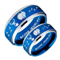 three blue rings with fish on them and the words score jewelry written in white lettering