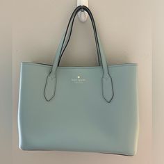 Brand New Without Tag Kate Spade Cross Body Handbag 2 Open Pockets And 1 Zippered Section. Material: Saffiano Leather And Silver Accents Color: Exterior: Robin Blue Interior: Dark Turquoise Measurements H: 9” Inches W: 11” Inches D: 7 1/2” Inches Strap Drop Short: 7” Inches Long: 18-21” Inches (Adjustable Strap) X Posted No Trades Classic Light Blue Shoulder Bag For Travel, Classic Light Blue Shoulder Bag For Everyday Use, Light Blue Office Bag, Classic Light Blue Travel Bag, Chic Light Blue Bags For Errands, Chic Light Blue Bag For Errands, Saffiano Leather Shoulder Bag With Double Handle For Shopping, Classic Blue Bag For Shopping, Light Blue Tote Bag For Office