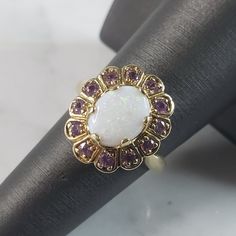 A Womens Vintage Estate 10k Yellow Gold Opal Amethyst Ring. The Ring Weighs 4.5g, And Is A Size 6.75. Opal Stone Is Surrounded By Amethyst Stones. This Makes A Lovely Gift For That Someone Special. Any Questions, Please Do Not Hesitate To Ask. Be Sure To Check Out Some Of My Other Great Items Up For Sale. Thank You. White Amethyst Jewelry For Formal Occasions, Formal White Amethyst Jewelry, White Amethyst Ring For Anniversary, Elegant Purple Opal Ring For Anniversary, Elegant White Amethyst Ring Gift, Elegant Purple Opal Anniversary Ring, White Amethyst Gemstone Ring For Anniversary, White Amethyst Ring For Promise, White Amethyst Promise Ring