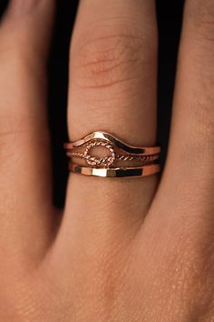 A curved arc stacking ring made from 14K Rose Gold Fill Metal. After countless requests and some fine tuning, we finally perfected this ring shape! The Teardrop Ring stacks with all of our rings beautifully. It adds dimension to any stacking rings you wear daily but it also makes the perfect, low-key wedding band! The bend in the Teardrop Ring curves to hug a set stone beautifully if you are looking for a complimentary piece for your existing engagement ring. This listing is for ONE SINGLE RING.Made from 14K ROSE GOLD FILL metal.Available in a SMOOTH or HAMMERED texture. The smooth finish is fully round metal.Each ring measures approximately 1.75 mm in width. We recommend stacking the Teardrop Ring with the Pebble Ring, one of our favorite dimensional pieces inspired by precious stone ring Low Key Wedding, Pebble Ring, Ring Stacks, Precious Stones Rings, Teardrop Ring, Single Ring, Ring Shapes, Stacking Ring, Cleaning Jewelry