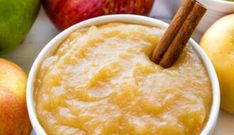 an apple and cinnamon dip with apples in the background