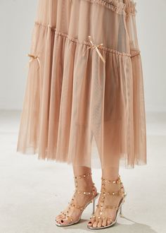 Enhance your summer style with our Beautiful Khaki Bow Ruffled Tulle Skirts. The delicate tulle material creates a romantic and feminine look, while the bow detail adds a touch of luxury. Perfect for any special occasion or a day out on the town, these skirts are a must-have for any fashion-forward woman. Fabric: TulleSize & Fit: This garment fits true to size.Length: Size M measures 31.2"from waist to hem.Waist:Fitted - elastic waist allows stretch Hip: Loosely Fitted. room for hips. Skirts Summer, Tulle Material, Tulle Skirts, Winter Dress Outfits, Feminine Look, Winter Dresses, Suits For Women, Knit Dress, Tulle Skirt