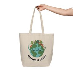 This tote bag will be the best companion on weekly shopping trips and is eco-friendlyl at the same time. It's made from natural, 10 oz./yd² cotton canvas fabric that is extremely durable and spacious with two comfortable shoulder straps. Material: 10oz./yd² natural cotton canvas fabricOne size: 18" x 15" (45.7cm x 38.1cm)Easy-carry handles and a spacious bottom 18" x 15" Width, in 17.99 Height, in 15.00 Total handle length, in 30.00 Refund / Exchange Policy: Since products are only printed once Green Large Capacity Cotton Shoulder Bag, Eco-friendly Green Canvas Bag For Travel, Large Capacity Green Cotton Shoulder Bag, Eco-friendly Large Canvas Cotton Bag, Eco-friendly Large Capacity Cotton Canvas Bag, Large Capacity Eco-friendly Cotton Canvas Bag, Eco-friendly Cotton Travel Bag, Eco-friendly Recyclable Shoulder Bag, Green Large Capacity Cotton Canvas Bag