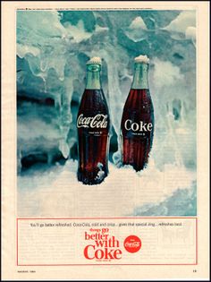 an advertisement for coca cola in the snow with two coke bottles next to each other