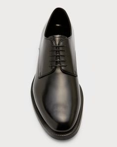 The iconic Giorgio Armani derby shoe provides both style and comfort for any business occasion. Crafted from only the finest smooth Italian leather, these shoes will age beautifully while hugging your foot. A delicate 1' stacked heel and rounded toe give a polished silhouette, while the lace-up front allows a snug fit. Slip them on with your smart trousers for elegance through the workday. Built to last in Italy, they offer timeless sophistication to complement any modern wardrobe. Modern Oxford Lace-up Shoes For Formal Occasions, Timeless Calf Leather Lace-up Shoes For Formal Occasions, Classic Calf Leather Lace-up Shoes For Derby, Classic Formal Lace-up Shoes With Rubber Sole, Timeless Calf Leather Lace-up Formal Shoes, Elegant Derby Shoes With Rubber Sole, Elegant Derby With Rubber Sole, Formal Leather Sole Derby Shoes, Formal Derby Shoes With Leather Sole And Plain Toe