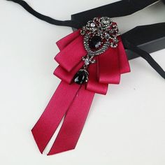 Elegant Red Pins For Party, Elegant Red Party Pins, Elegant Ribbon Lapel Pin For Party, Elegant Party Bow Tie Pins, Elegant Party Pins With Bow Tie Detail, Elegant Wedding Lapel Pin With Ribbon, Elegant Rhinestone Brooch For Party, Formal Dress Accessories, Wedding Formal Dress