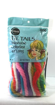 the bag is full of colorful yarns for crafts and sewing projects, including t - tails