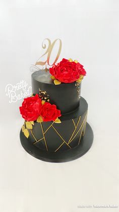 a black and gold cake with red roses on it's side, the number twenty nine