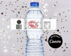 a bottle of water with a sticker on the label and confetti around it