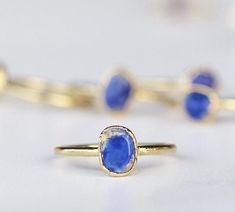 A bright and beautiful lapis lazuli stone is picked with intention and set on a delicate gold band with an organic style setting. ⭐️  Each ring is made by hand and finished with an ultra heavy, nickel free 14k gold plate. Our 14k gold plate is 20 times thicker than most commercial jewelry and intended to last. Stones are about 1/4 inch in size. Please keep in mind that they are natural, so will vary in exact shape, color and size. No two are alike, but all are equally beautiful.Every item purcha Classic Lapis Lazuli Ring As Gift, Gold Lapis Lazuli Gemstone Rings, Gold Lapis Lazuli Ring For Gift, Lapis Lazuli Gemstone Ring For Gift, Oval Lapis Lazuli Rings For Gift, Raw Lapis Lazuli, Raw Rose Quartz, Raw Stone Ring, Lapis Lazuli Ring