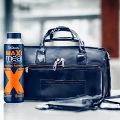 an image of a man's bag and grooming products on the counter top