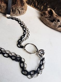 "Chains leather O ring long necklace, black fringe necklace, womens bold black silver necklace, black steampunk necklace, statement necklace Welcome to my shop! ✈️ DHL EXPRESS SHIPPING AVAILABLE, 1-3 BUSINESS DAYS DELIVERY! ✔️ PLEASE MAKE SURE TO SELECT IT, RIGHT BEFORE YOUR PURCHASE! ❗️ ❗️ DON'T FORGET TO ADD YOUR CELL # AT THE \"NOTE TO SELLER\" SECTION IF YOU CHOOSE DHL! BY FILLING YOUR CELL NUMBER YOU EARN THE BENEFIT TO CHOOSE BETWEEN 6 DIFFERENT DELIVERY OPTIONS! INSTRUCTIONS WILL BE SENT Edgy Black Jewelry With Chunky Chain, Edgy Black Necklace With Silver Chain, Edgy Black Chunky Chain Jewelry, Modern Black Lariat Jewelry, Everyday Black Necklace With Chunky Chain, Modern Black Lariat Necklace, Modern Black Necklace With Oxidized Finish, Modern Black Chain Necklace For Party, Modern Black Chunky Chain Jewelry