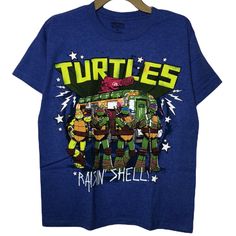 Classic Graphic Short Sleeves Tee Featuring The Teenage Mutant Ninja Turtles. Brand New Without Tags! No Flaws. Official Licensed Product. We Are A Smoke-Free And Pet-Free Home. J Blue Crew Neck Top With Pop Culture Style, Blue Crew Neck Tops In Pop Culture Style, Blue Crew Neck Top In Pop Culture Style, Blue Fan Apparel Tops With Character Print, Blue Tops With Character Print For Fans, Blue Character Print Fan Apparel Tops, Blue Pop Culture Fan Merchandise Top, Blue Character Print Tops For Fans, Blue Cotton Pop Culture Tops