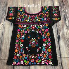 "Armpit to armpit 17\" Armhole 8\" Long 26\" Best fits Small may fit Median Completely handmade by Mexican artisans Embroidered by hand. Ready to ship!" Fitted Folk Tops With Intricate Embroidery, Folk Style Fitted Tops With Intricate Embroidery, Fitted Short Sleeve Tops With Geometric Embroidery, Traditional Crew Neck Top With Floral Embroidery, Fitted Traditional Tops With Geometric Embroidery, Fitted Tops With Geometric Embroidery In Traditional Style, Traditional Fitted Tops With Motif, Traditional Motif Fitted Top, Fitted Traditional Motif Tops