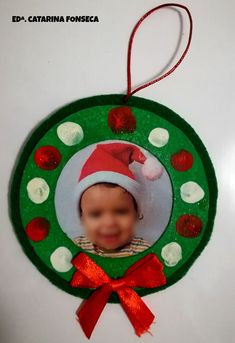 a christmas ornament with a baby's face on it