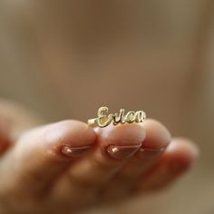 "14K Solid Gold Name Ring-Dainty Name Ring- Custom Stacking Name Ring - Birthday Gift- Bridesmaid-Gift For Mom-Gift For Her 14K Solid Gold Name ring will be handmade with your desired, Here is a dainty, delicate and simple, yet classy minimalist Name Ring . This is 14k Solid Yellow Gold. (this necklace is 100% real. It's not plated ) Perfect for everyday use. A beautiful customized gift for yourself or someone you care for. \"What's in a name?\" Spell out a name and let us create a beautiful gif Dainty Custom Name Rings For Wedding, Dainty Personalized Ring For Birthday, Gold Rings For Mother's Day Birthday Gift, Adjustable Gold Rings For Birthday Gift, Gold Minimalist Rings For Birthday, Gold Ring Jewelry For Birthday Gift, Personalized Dainty Rings For Birthday, Dainty Personalized Birthday Ring, Gold Ring For Birthday Gift