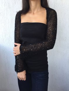 This Original Knitted Shrug, Elegant Long Sleeve Bolero, Bridesmid Shrug, Open Cardigan, Black Bolero is 100% Handmade with all my Love and Care. This Elegant Knitted Shrug is: - 100 % handmade of high quality blend yarn - wrapped in smoke-free, pet-free boutique in a special unique way - a staple piece for your collection - four seasons top - perfect for any occasion, day or night - great romantic present for yourself or someone special in your life SIZES: S-M Sleeve edge to sleeve edge approxi Long White Blouse, Knitted Shrug, Black Bolero, Sleeve Bolero, Bolero Wedding, Knit Shrug, Off White Dresses, Cardigan Black, Open Cardigan