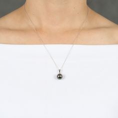 Classically elegant- a single large cultured South Sea Tahitian pearl pendant is just right for everyday wear or for that special occasion. 
Due to the unique nature of pearls, shade of color, shape or texture, may vary slightly from photo. Tahitian Pearl Pendant Jewelry, Tahitian Pearl Charm Necklace With Round Pendant, Tahitian Pearl Necklace With Round Pendant And Pearl Charm, Tahitian Pearl Necklace With Round Pendant, Tahitian Pearl Pendant Round Necklaces, Tahitian Pearl Pendant Necklace, Classic Tahitian Pearl Drop Necklace, Lose A Stone, Tahitian Pearl Pendant