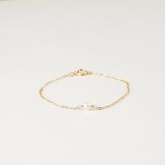 Dainty and classic, our Aura tiny pearl bracelet is a beautiful piece to wear everyday. Simple and timeless, you can wear it with everything. P R O D U C T * D E T A I L S - Pearl measures approximately 3.5mm - Available in Sterling Silver, 14k Gold Filled and 14k Rose Gold Filled - Each freshwater pearl is unique meaning the size and shape may vary - Wire wrapping detail - Available in Sterling Silver, 14k Gold Filled and 14K Rose Gold Filled L E N G T H - This bracelet is measured opened from Tiny Bracelet, Bracelet Layering, Unique Meaning, Bracelet Elegant, Bracelet Dainty, Dainty Bracelet, Freshwater Pearl Bracelet, Elegant Bracelet, Dainty Bracelets