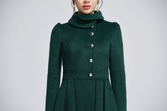 "Elegant and comfortable princess coat made of beautiful dark green wool. Unique design will let you shine wherever you go, perfect for every occasion. Details: * Made from dark green wool fabric, polyester lining * lapel collar * long sleeves * Regular fit * button closure in front * two pockets * above knee length CUSTOM MADE SERVICE If you * Need a tailored clothes with your body measurement * Need a Better fit * Can't find your size in the size Chart * Make this clothes in other Color * Chan Elegant Green Wool Outerwear, Elegant Double-breasted Wool Coat, Elegant Long Wool Coat In Solid Color, Elegant Long Wool Coat Solid Color, Chic Green Wool Coat For Winter, Elegant A-line Wool Coat, Elegant Green Long Sleeve Outerwear, Elegant Green Wool Coat For Winter, Elegant Green Wool Coat For Fall