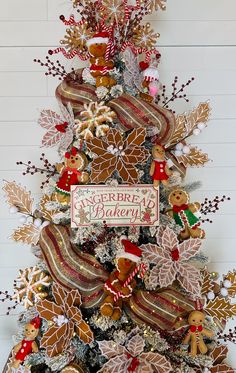 a decorated christmas tree with gingerbreads and cookies