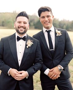 two men in tuxedos standing next to each other