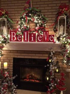 a fireplace decorated for christmas with wreaths and lights