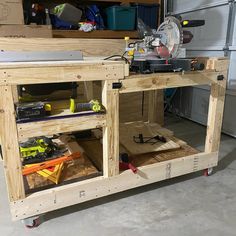 a workbench made out of wood with tools on the top and below it