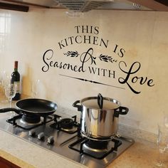 this kitchen is seasoned with love wall decal sticker on the backsplash of a stove