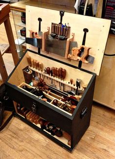 a wooden box filled with lots of tools