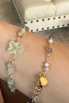 This bracelet features prehnite--"The Dreamer's Stone"--and a dainty flower charm at its center. It is connected by hand bent gold filled wire and features an adjustable clasp.  Prehnite is connected to the heart chakra and is a stone connected to deep kindness and compassion. It is sometimes referred to as the healer's gemstone. It can also help the wearer connect to elemental spirits, practice lucid dreaming and divination, and communicate with other planes of existence. Let this powerful stone protect your earthly body while your spirit soars.  Affirmation when wearing: My body is grounded and my consciousness is free to soar. I have the power to make my dreams into reality. Elemental Spirits, Planes Of Existence, Kindness And Compassion, Dream Bracelet, Lucid Dreams, Lucid Dreaming, Flower Charm, Heart Chakra, Adjustable Bracelet