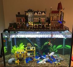 a fish tank filled with legos on top of a table