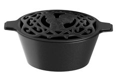 a black cast iron pot with a rooster design on the front and sides, sitting on a white background