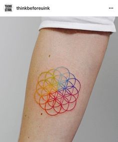 a person with a colorful tattoo on their arm