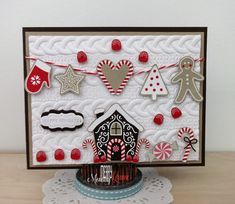 a handmade christmas card with gingerbreads, candy canes and cookies on it