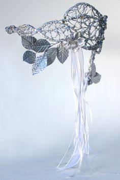 "Inspired by the headpiece worn by Sarah (played by Jennifer Connelly) in the masquerade ball scene in the 1986 movie \"Labyrinth.\" The piece is made with an copper wire skeleton, that is covered with hot glue in a manner to replicate the vine-like quality of the original. This also allows the piece to be bent into shape so that it can fit any head. The piece is accentuated with acrylic rhinestones, a variety of silver and white ribbons, and silver flowers and leaves. Here is an image from the Fantasy Crown For Masquerade, Fantasy Crown Masquerade Costume Accessories, Mystical Crown Headpiece For Masquerade, Silver Fantasy Headpiece For Costume Party, Silver Fantasy Party Headpiece, Fantasy Masquerade Costume Headband, Fantasy Masquerade Headband Costume, Fantasy Style Masquerade Costume Headband, Elegant Crown Headpiece For Masquerade