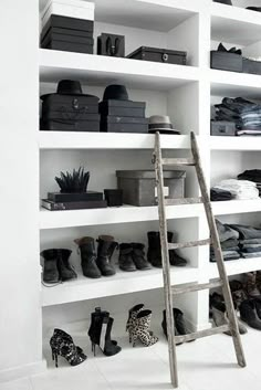 a ladder leaning against a white shelf filled with shoes