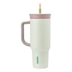 a white coffee cup with a pink handle