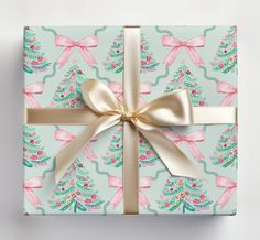 a present wrapped in blue wrapping paper with gold ribbon