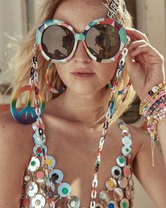 Far out, man! These super fun sunnies are the physical embodiment of Peace, Love, and Fabulous! Made of a round, multicolored frame with an all-over geometrical pattern these sunnies are the perfect accessory for bringing the bohemian hippie vibes with you everywhere you go! The stems have removable hanging colorful peace sign tassels at the temple and a removable, multicolored acrylic chain that can also be worn as a groovy mask chain. These fabulous sunnies ship with a cleansing cloth and prot Geometrical Pattern, Mask Chain, Hippie Vibes, Good Humor, The Bohemian, Bohemian Hippie, Resort Collection, Swim Accessories, Hippie Bohemian