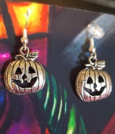 This is a pair of Jacko lantern pumpkin charm Halloween earrings. They are 1 1/4 inches long. Fun fall or holiday earrings  Item#jewls6071 Spooky Nickel-free Silver Earrings, Spooky Silver Nickel-free Earrings, Nickel-free Silver Earrings For Halloween, Silver Spooky Halloween Earrings, Pumpkin Earrings, Holiday Earring, Halloween Earrings, Fall Fun, Metal Jewelry