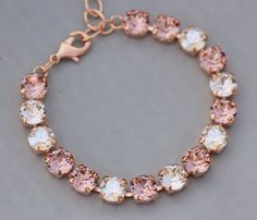 "Gorgeous new bracelets made using premium rose gold settings and Swarovski rhinestones. The rhinestones are blush colored, crystal clear, and moonlight in color. The mix of the three colors are truly stunning! Stones are 8mm in size and are hand set into the premium rose gold bracelet settings. Bracelet closes with a rose gold lobster clasp. Bracelet can adjust in length from 6-8\" in length. Perfect for any rose gold or blush themed wedding or special occasion! ** Made to match these best sell Bracelet Tennis, Peach Morganite, Vintage Rose Gold, Morganite Diamond, Swarovski Crystal Bracelet, Rose Blush, Jewelry Bridesmaid, Rose Pastel, Rose Gold Bracelet