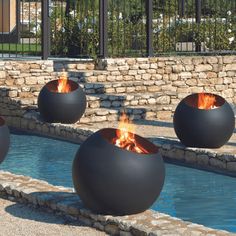 fire pit sitting in the middle of a swimming pool