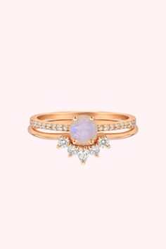 Searching for stacking rings? Discover our Rose Gold Rainbow Moonstone & Topaz Dancing Fairy Ring set at La Kaiser. Crafted with 14kt rose gold, natural white topaz, and vibrant rainbow moonstones, this 3-ring set is ideal for gemstone lover. Add a colorful touch to your everyday style with this unique jewelry piece. Shop now! Rose Gold Moonstone Ring With Gemstone, Rose Gold Moonstone Ring With Rose Cut Diamonds, Dainty Rose Gold Moonstone Ring, Stackable Round Moonstone Ring In Rose Gold, Stackable Rose Gold Moonstone Ring, Celestial Rose Gold Gemstone Rings, Celestial Rose Gold Crystal Promise Ring, Rose Gold Celestial Moonstone Ring For Anniversary, Celestial Rose Gold Moonstone Ring For Anniversary