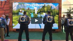 people standing in front of a large screen with the words jump to time off in it