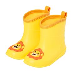 a pair of yellow rain boots with a lion on the side