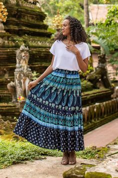 A mix of paisley motif fabrics in assorted blue shades compose this rayon skirt from Thailand's Ying and Joy. The tiered, ruffled skirt features a comfortable elastic waist with a drawstring to adjust the fit. Blue Bohemian Tiered Bottoms, Bohemian Blue Tiered Bottoms, Flowy Paisley Print Tiered Skirt, Flowy Tiered Skirt With Paisley Print, Blue Tiered Gathered Skirt, Long Paisley Print Skirt, Bohemian Tiered Skirt With Paisley Print, Bohemian Paisley Print Skirt, Bohemian Flowy Paisley Print Skirt